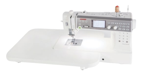 Janome MC6700P with its included extra-wide quilting table
