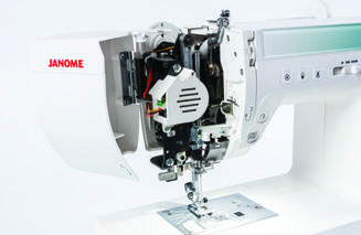 Sewist 780DC with its face plate open to show the upper thread path